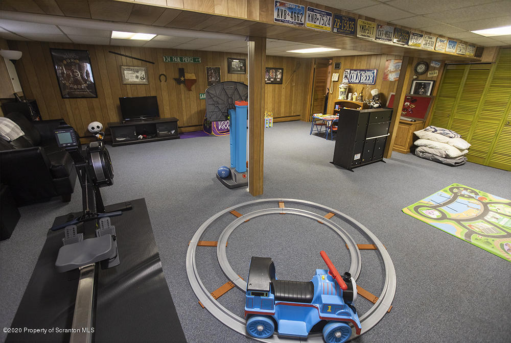 105 Sturbridge Road Clarks Summit, PA 18411 - Photo 47 of 56 a room with gym equipment and mirror