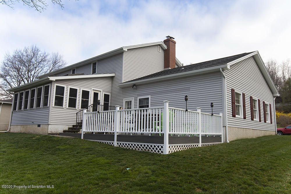 105 Sturbridge Road Clarks Summit, PA 18411 - Photo 53 of 56 a front view of a house with a garden