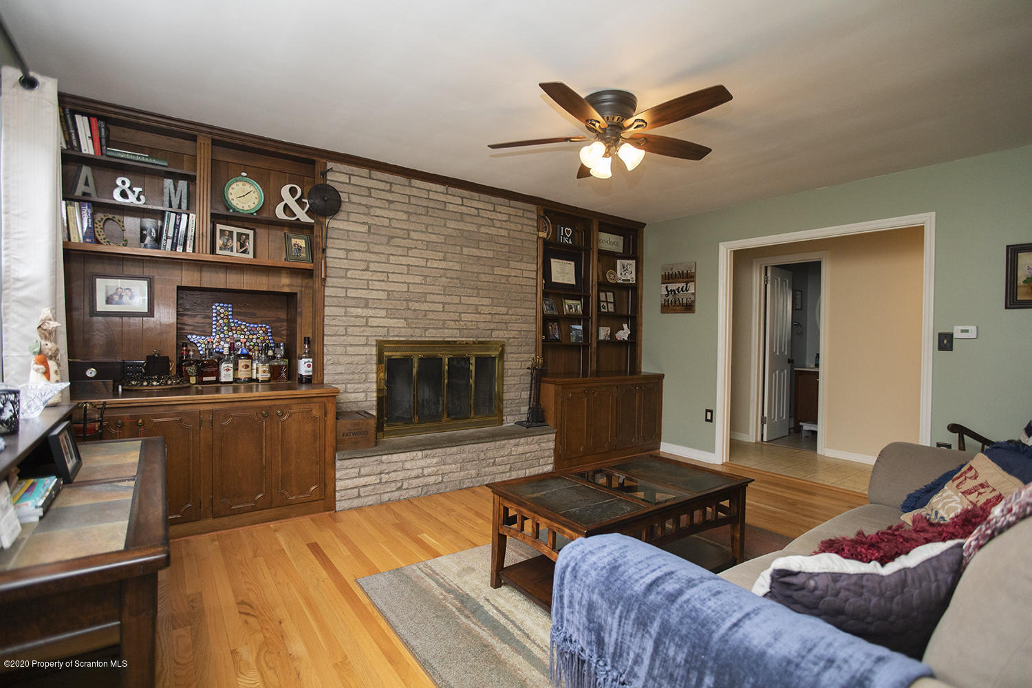 105 Sturbridge Road Clarks Summit, PA 18411 - Photo 6 of 56 a living room with furniture and a fireplace