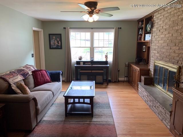 105 Sturbridge Road Clarks Summit, PA 18411 - Photo 10 of 56 a living room with furniture and a fireplace