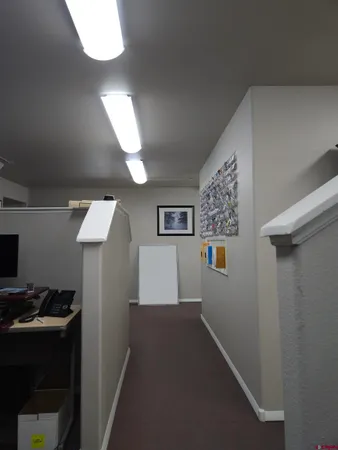 a view of a hallway with workspace