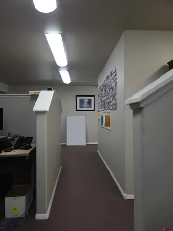 a view of a hallway with workspace