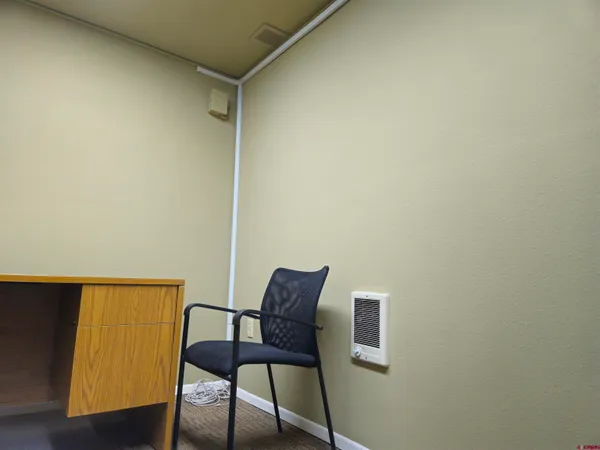 a view of a room with a table and chair