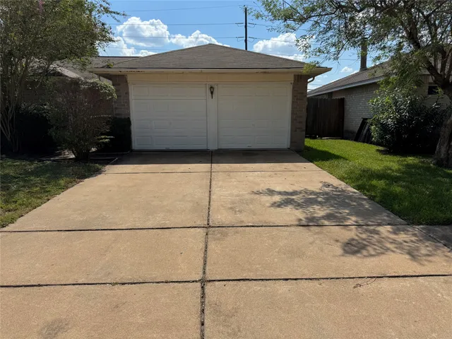 a front view of a house with garage