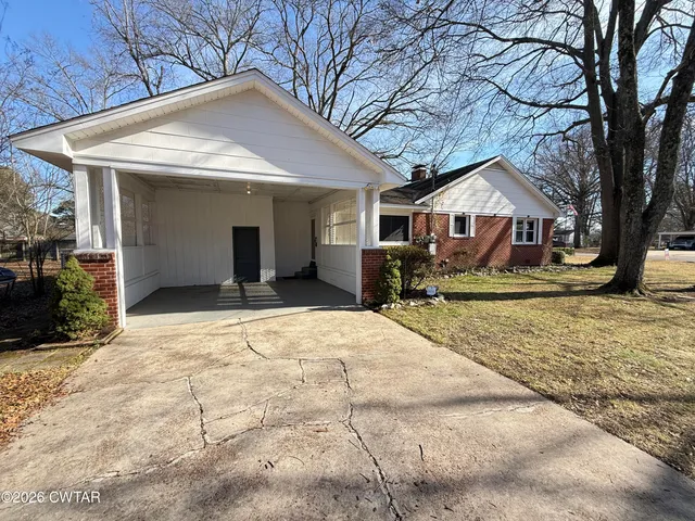 a view of a house with snow on the wall