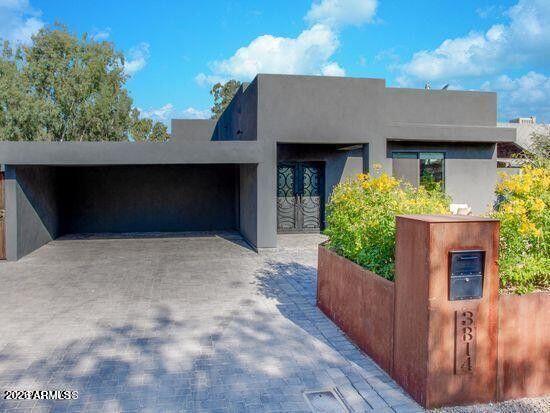 a front view of a house with a garage