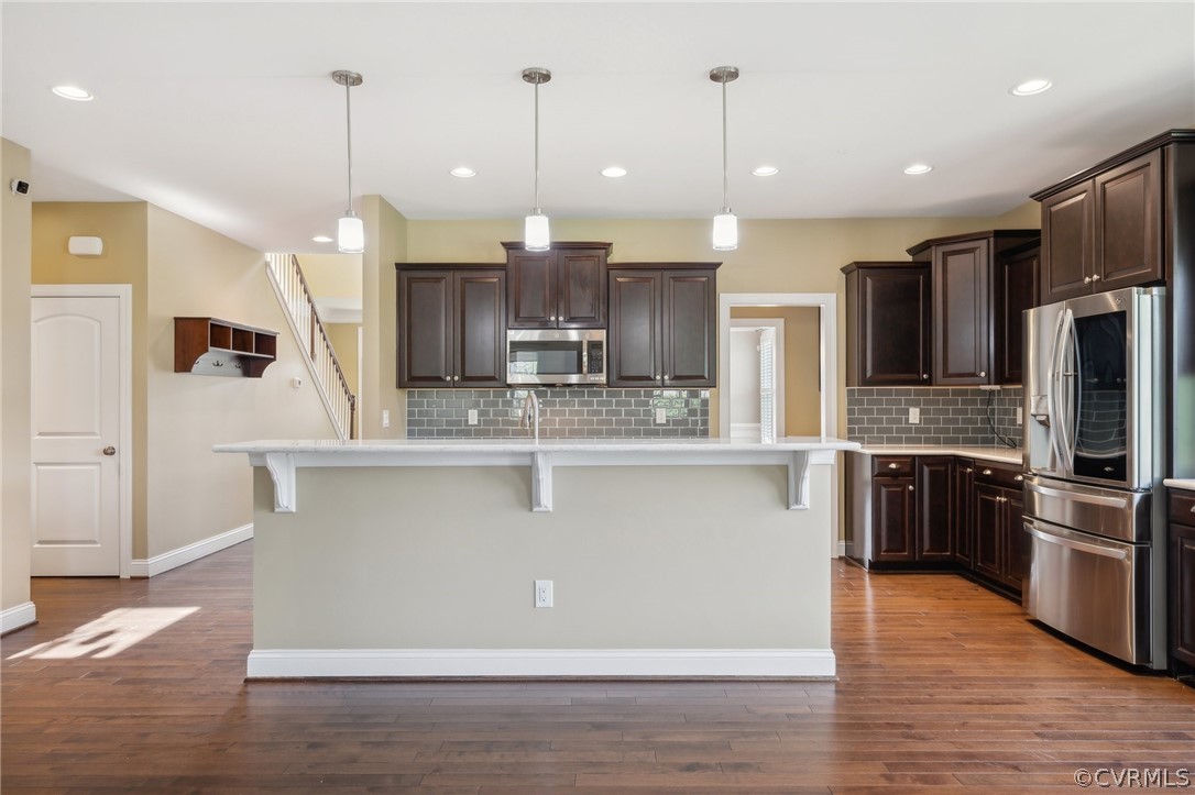 7004 Benhall Circle Glen Allen, VA 23059 - Photo 18 of 50 a view of kitchen with stainless steel appliances granite countertop cabinets and wooden floor