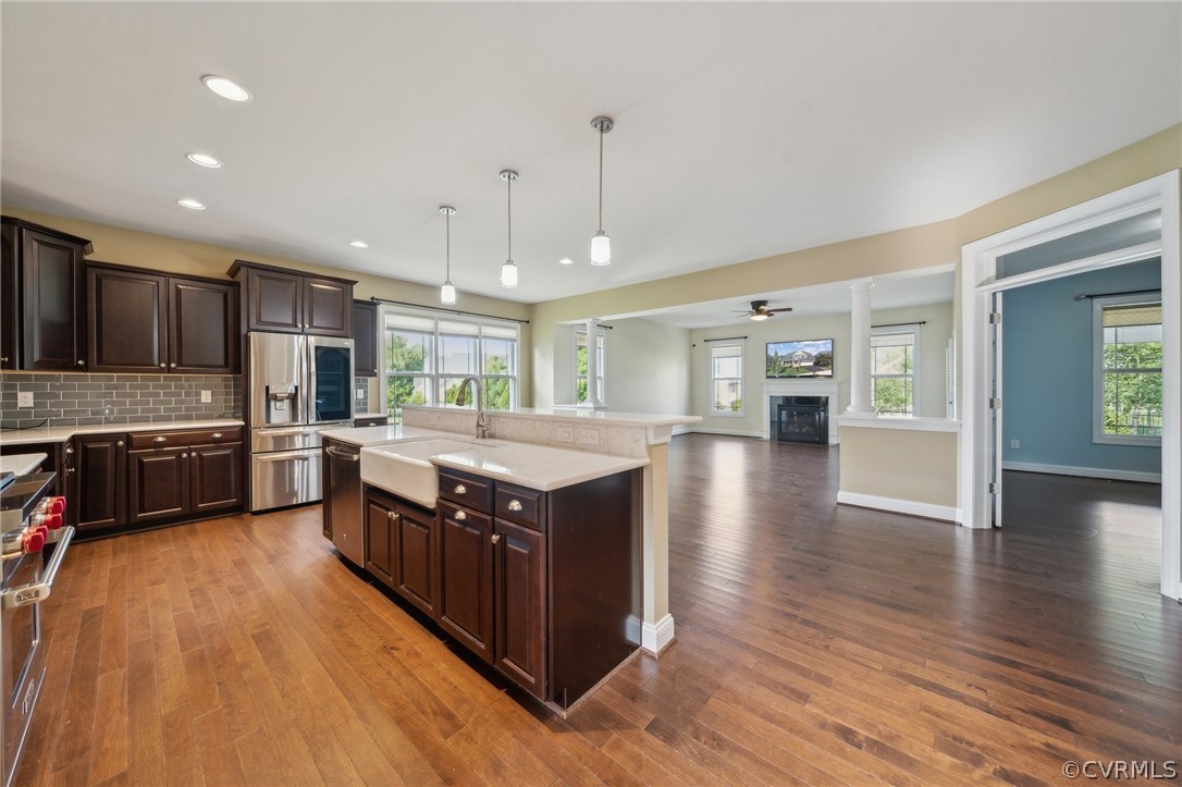 7004 Benhall Circle Glen Allen, VA 23059 - Photo 20 of 50 a kitchen with wooden floors and wooden cabinets