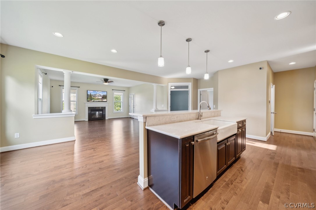 7004 Benhall Circle Glen Allen, VA 23059 - Photo 22 of 50 a kitchen with stainless steel appliances granite countertop a sink a stove and a wooden floors
