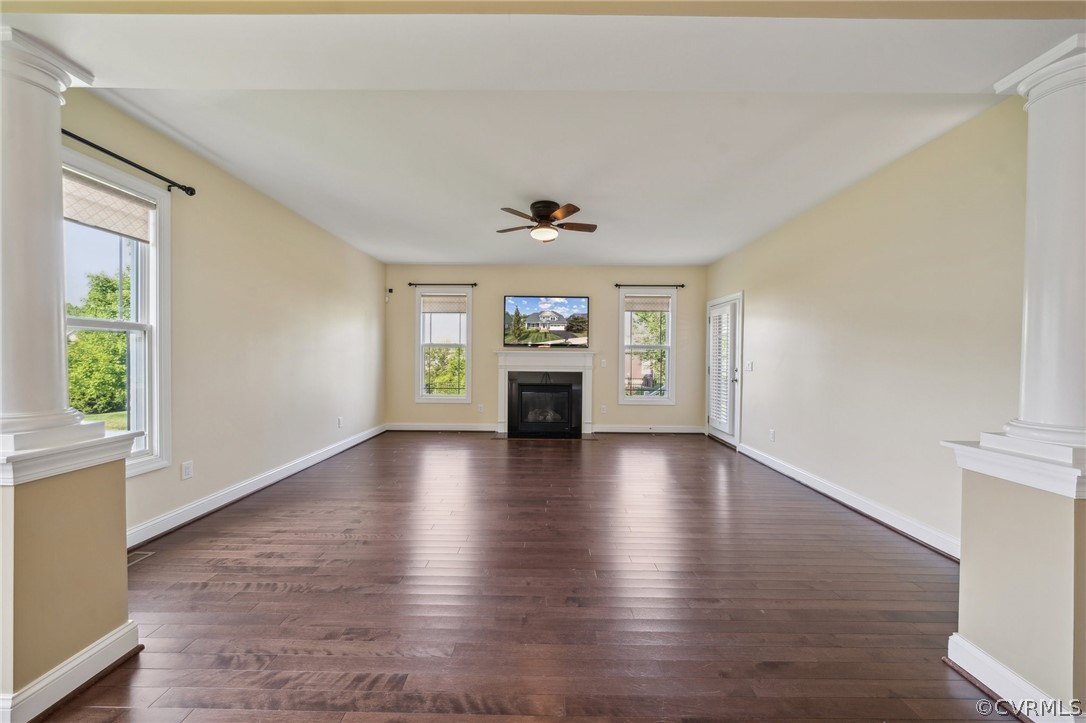 7004 Benhall Circle Glen Allen, VA 23059 - Photo 23 of 50 an empty room with wooden floor chandelier and windows