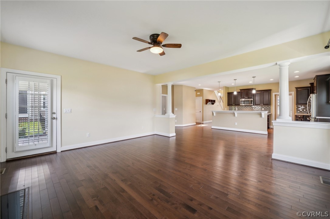 7004 Benhall Circle Glen Allen, VA 23059 - Photo 25 of 50 a view of a livingroom with furniture wooden floor and a kitchen