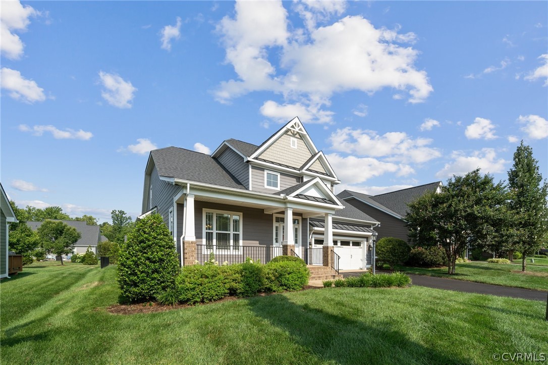 7004 Benhall Circle Glen Allen, VA 23059 - Photo 3 of 50 a front view of a house with a yard