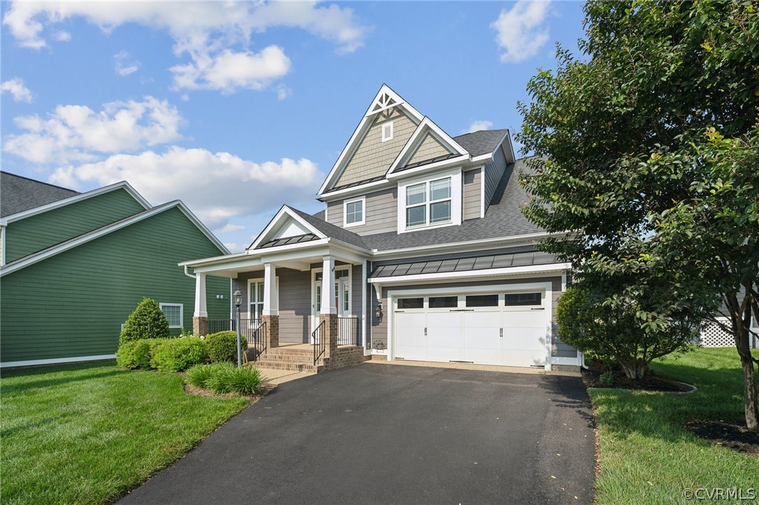 7004 Benhall Circle Glen Allen, VA 23059 - Photo 4 of 50 a front view of a house with a yard and garage