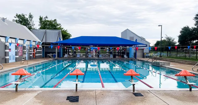 a group of people sitting outside of a park