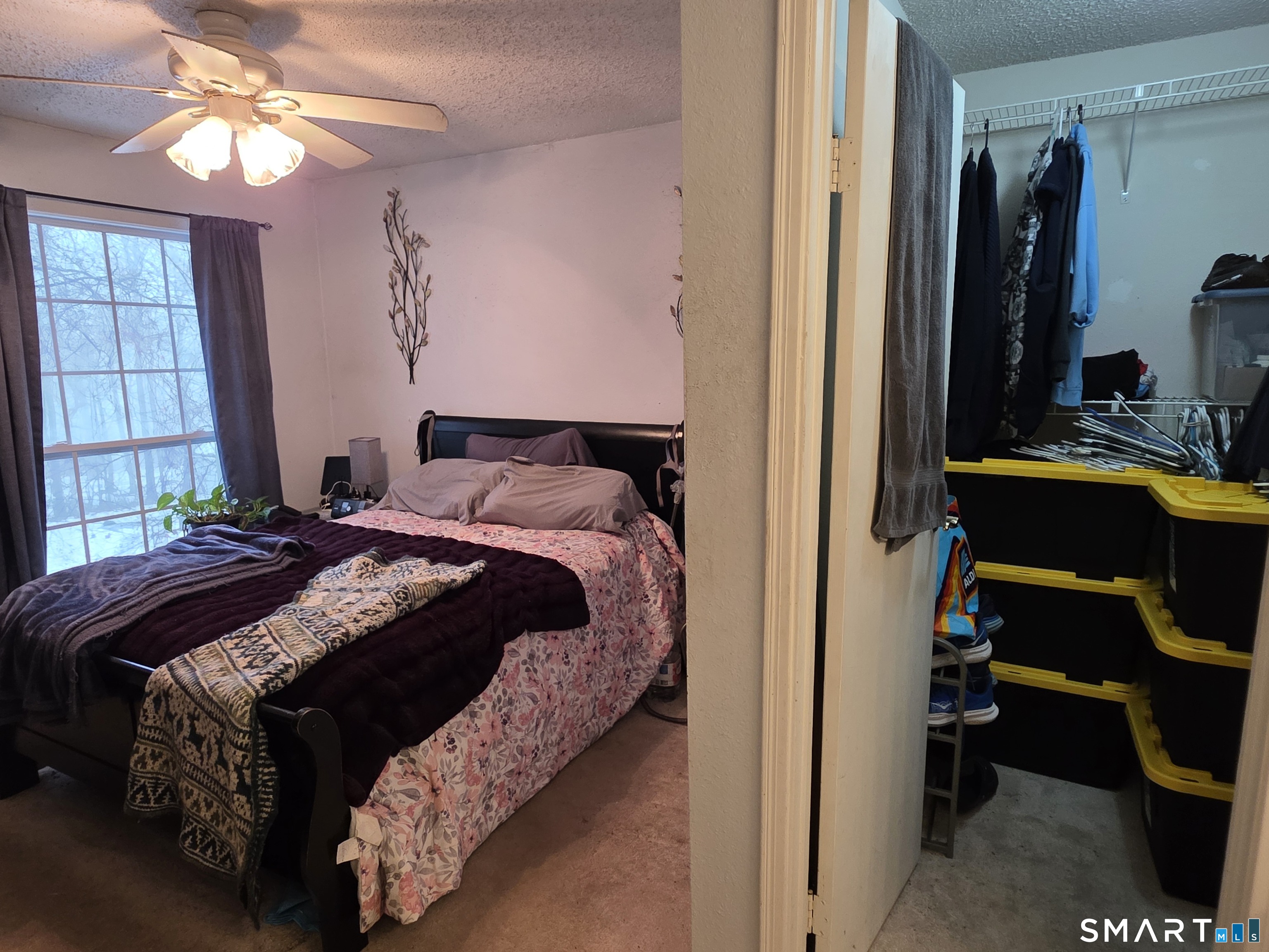 90 Crown Knoll Court, Unit 144 Groton, CT 06340 - Photo 25 of 38 a bedroom with a bed and a desk