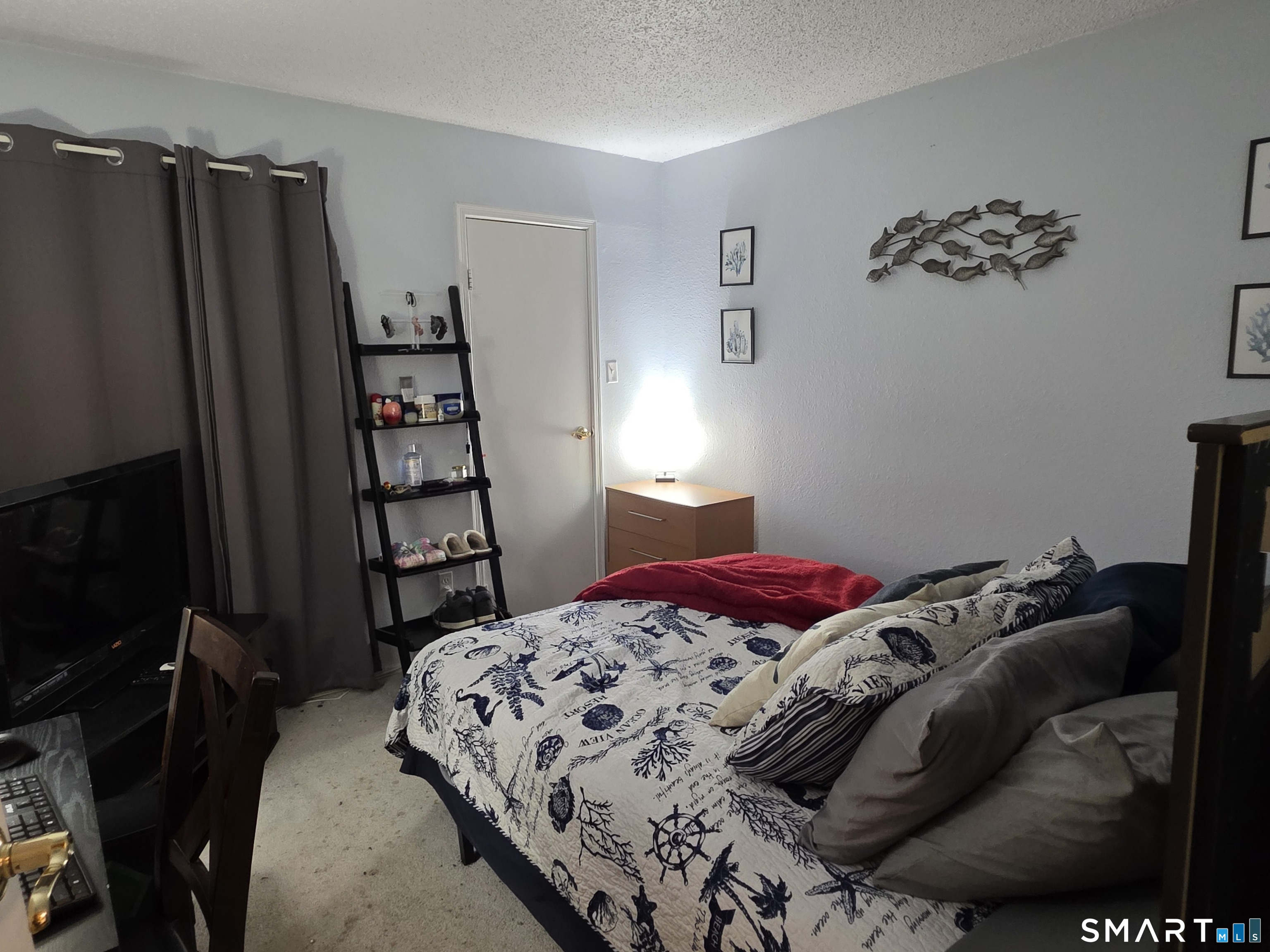 90 Crown Knoll Court, Unit 144 Groton, CT 06340 - Photo 26 of 38 a bedroom with a bed and a closet