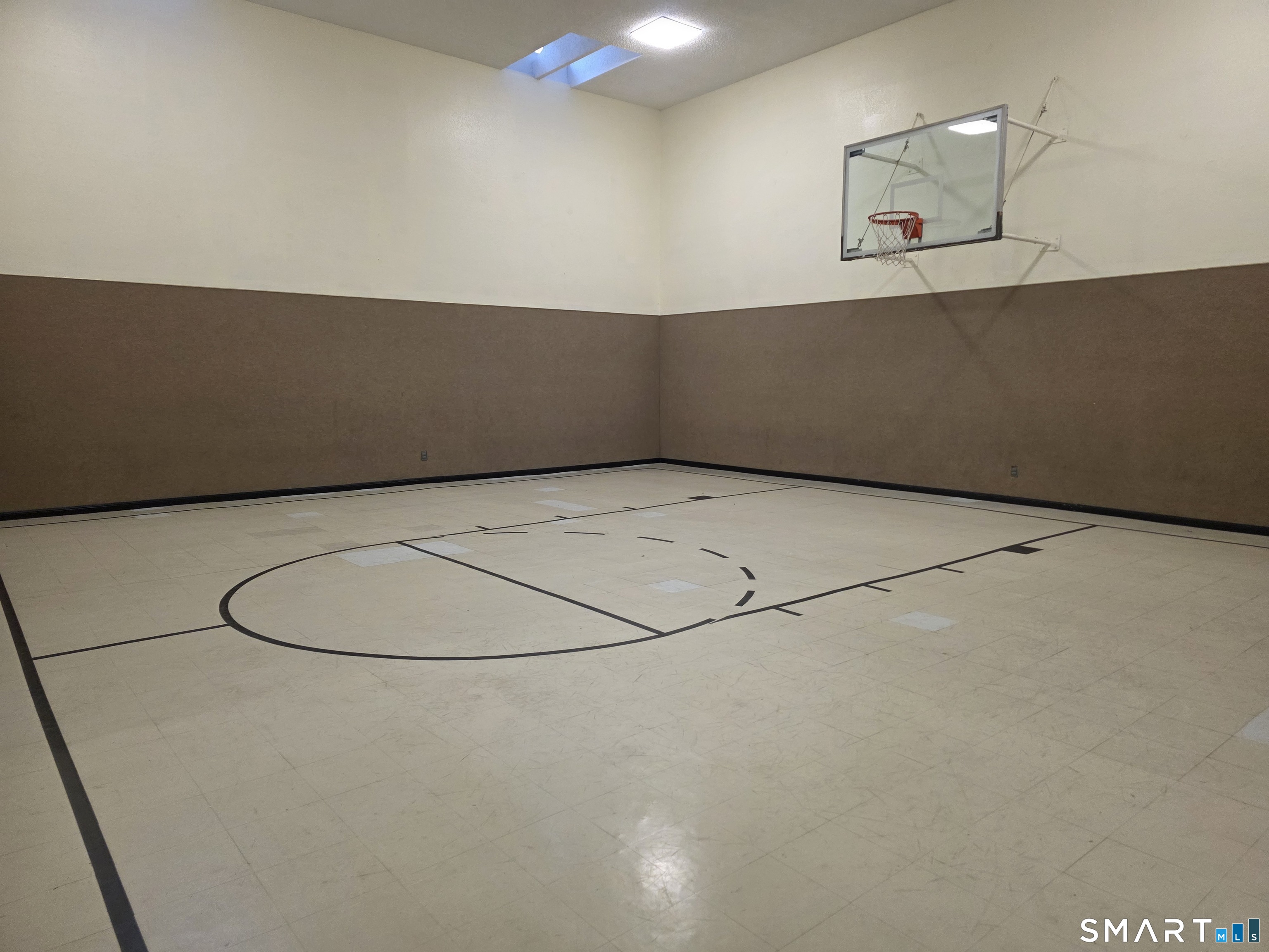 90 Crown Knoll Court, Unit 144 Groton, CT 06340 - Photo 32 of 38 a view of a room with wooden floor and white walls