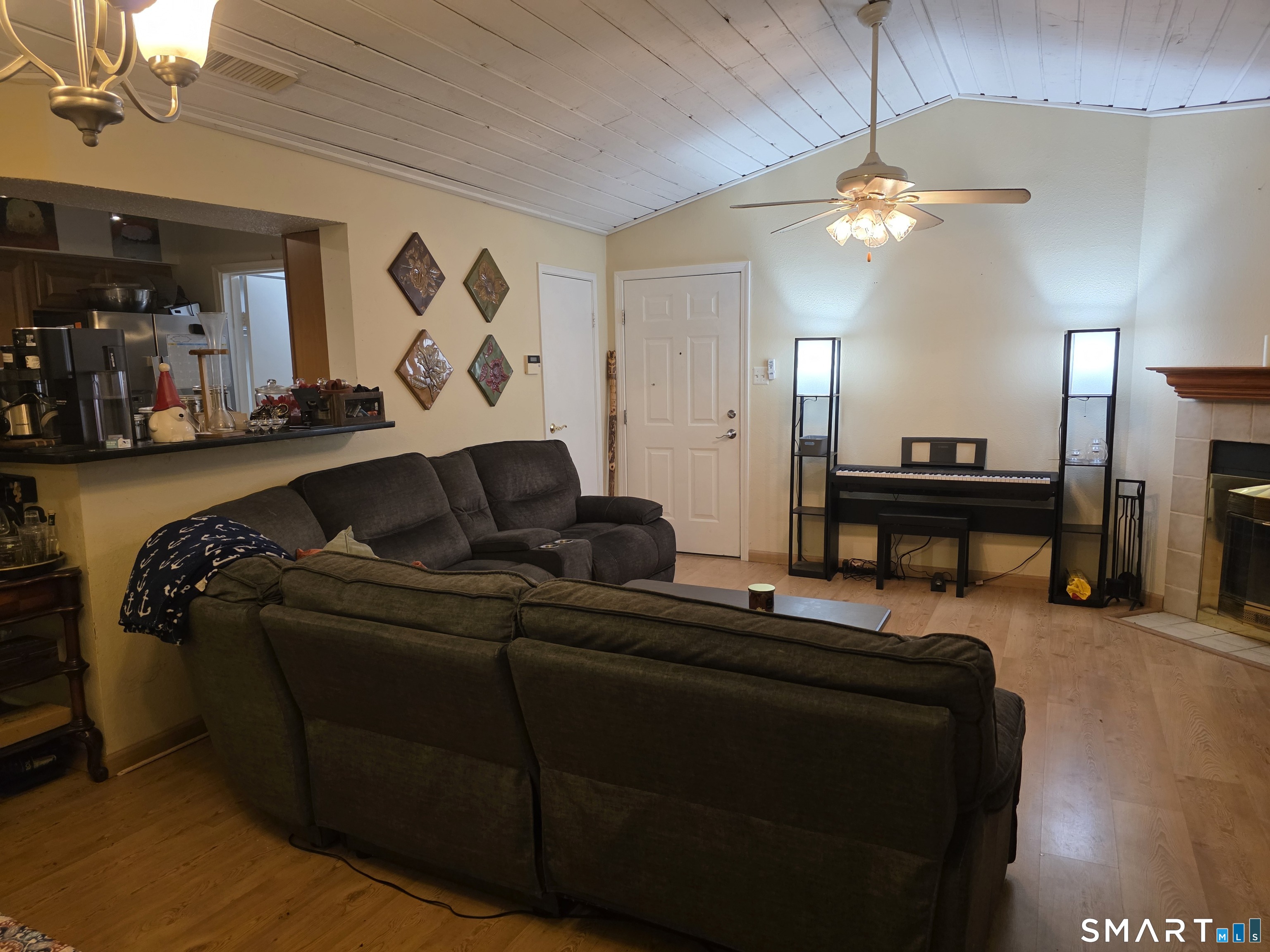 90 Crown Knoll Court, Unit 144 Groton, CT 06340 - Photo 8 of 38 a living room with furniture and a chandelier