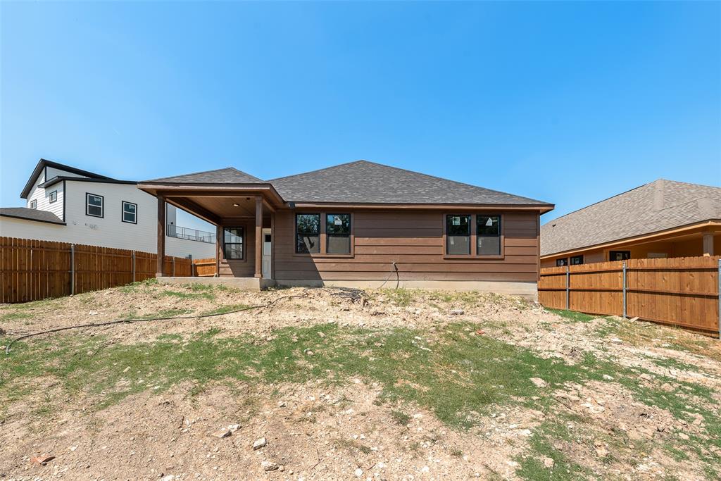 6031 Plum Dale Road Dallas, TX 75241 - Photo 18 of 23 a front view of a house with a yard