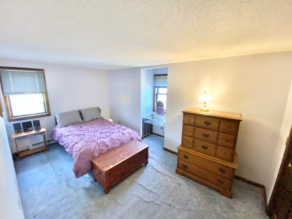 1 Pinewood Road Wareham, MA 02532 - Photo 11 of 16 a bedroom with a bed and a cabinets