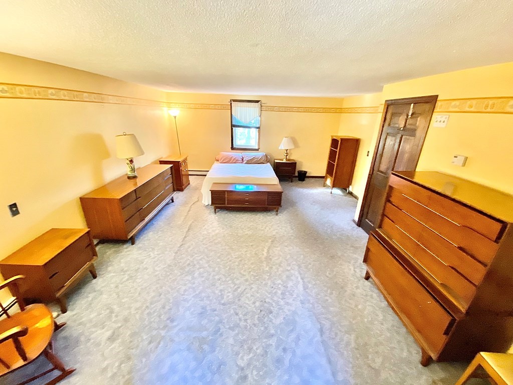 1 Pinewood Road Wareham, MA 02532 - Photo 14 of 16 a bedroom with furniture and a large window