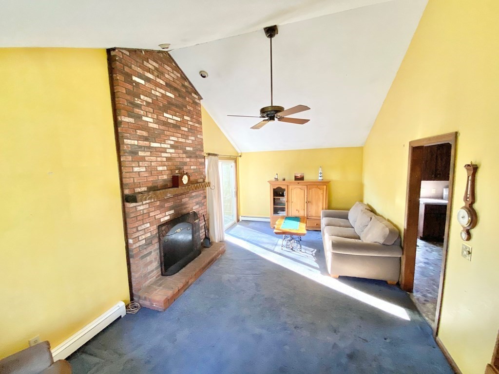 1 Pinewood Road Wareham, MA 02532 - Photo 3 of 16 a living room with furniture and a fireplace