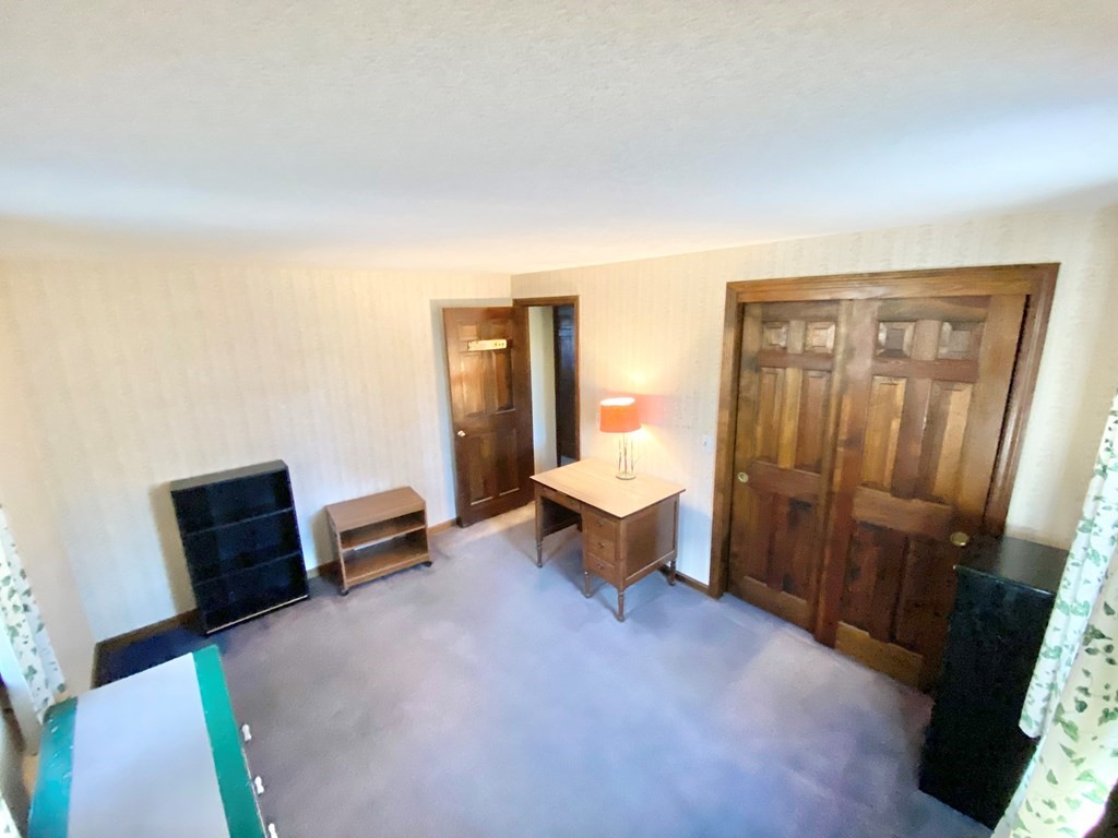 1 Pinewood Road Wareham, MA 02532 - Photo 8 of 16 a living room with furniture a mirror and a wooden floor