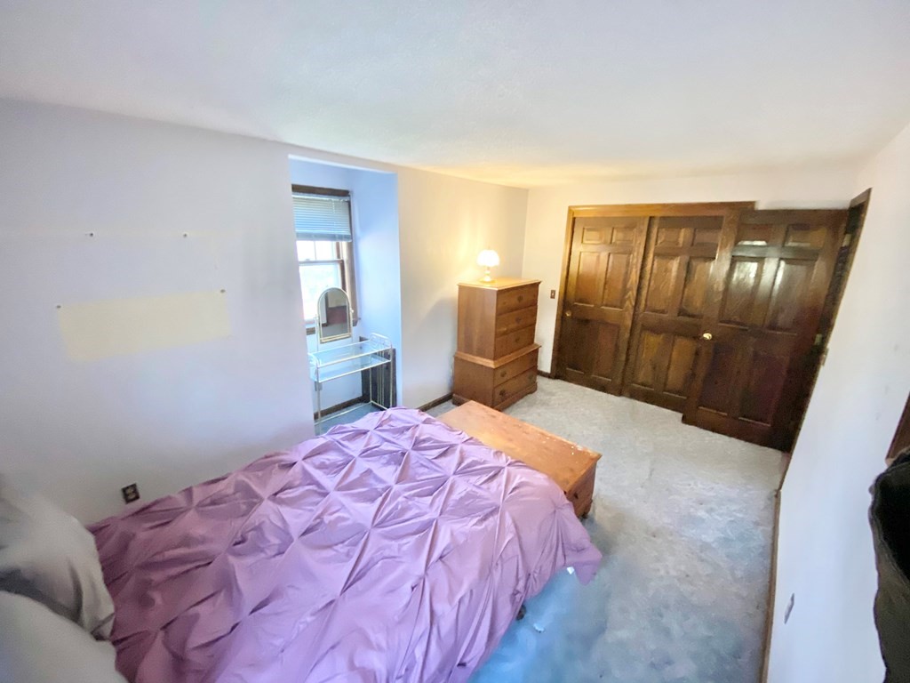 1 Pinewood Road Wareham, MA 02532 - Photo 10 of 16 a bedroom with a bed and a mirror on dresser