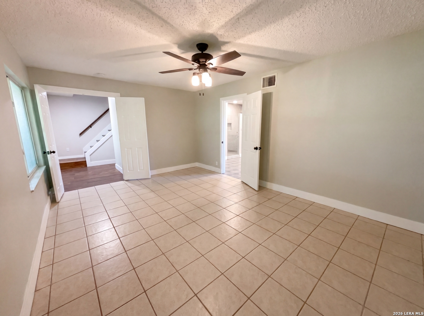 15422 Geronimo Loop San Antonio, TX 78254 - Photo 12 of 21 a view of an empty room and chandelier fan