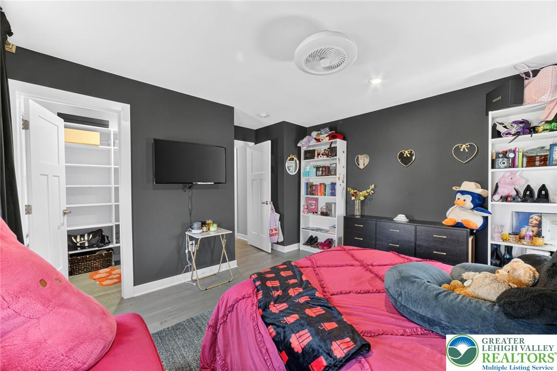 3952 Orth Street Bethlehem, PA 18020 - Photo 34 of 60 Streamlined ceiling fan and recessed lighting illuminate a cozy bedroom retreat.