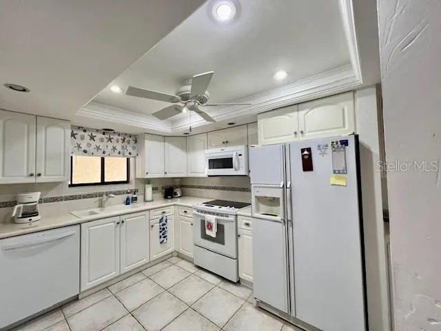 a view of a livingroom with furniture and a window