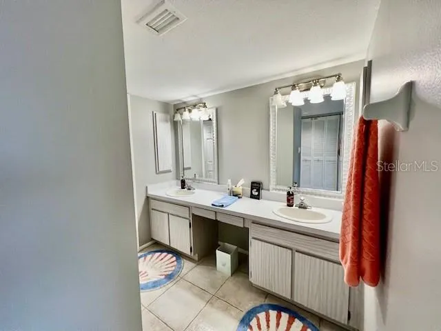 a bedroom with a bed and a cabinets