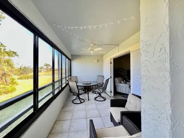 a living room with fireplace furniture and a flat screen tv