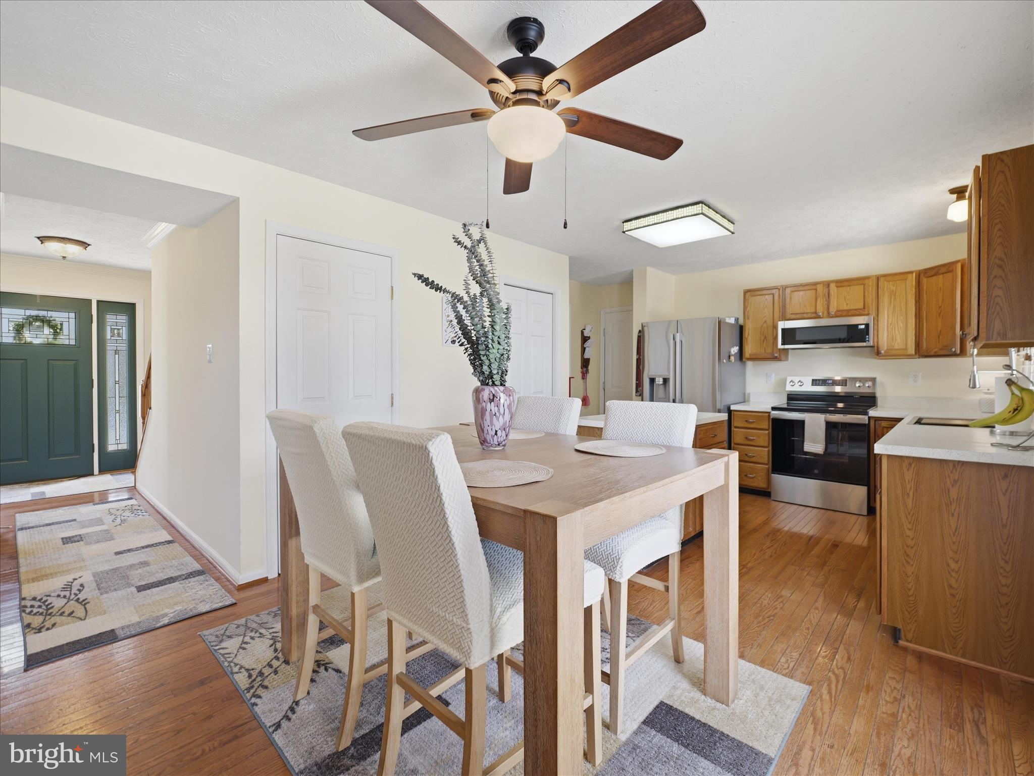 7 Coldstream Court Boonsboro, MD 21713 - Photo 15 of 43 a kitchen with stainless steel appliances kitchen island granite countertop a table chairs and a refrigerator