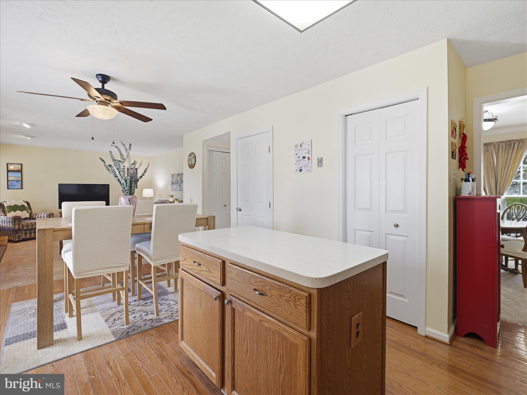 7 Coldstream Court Boonsboro, MD 21713 - Photo 17 of 43 a kitchen that has a table chairs and wooden floor