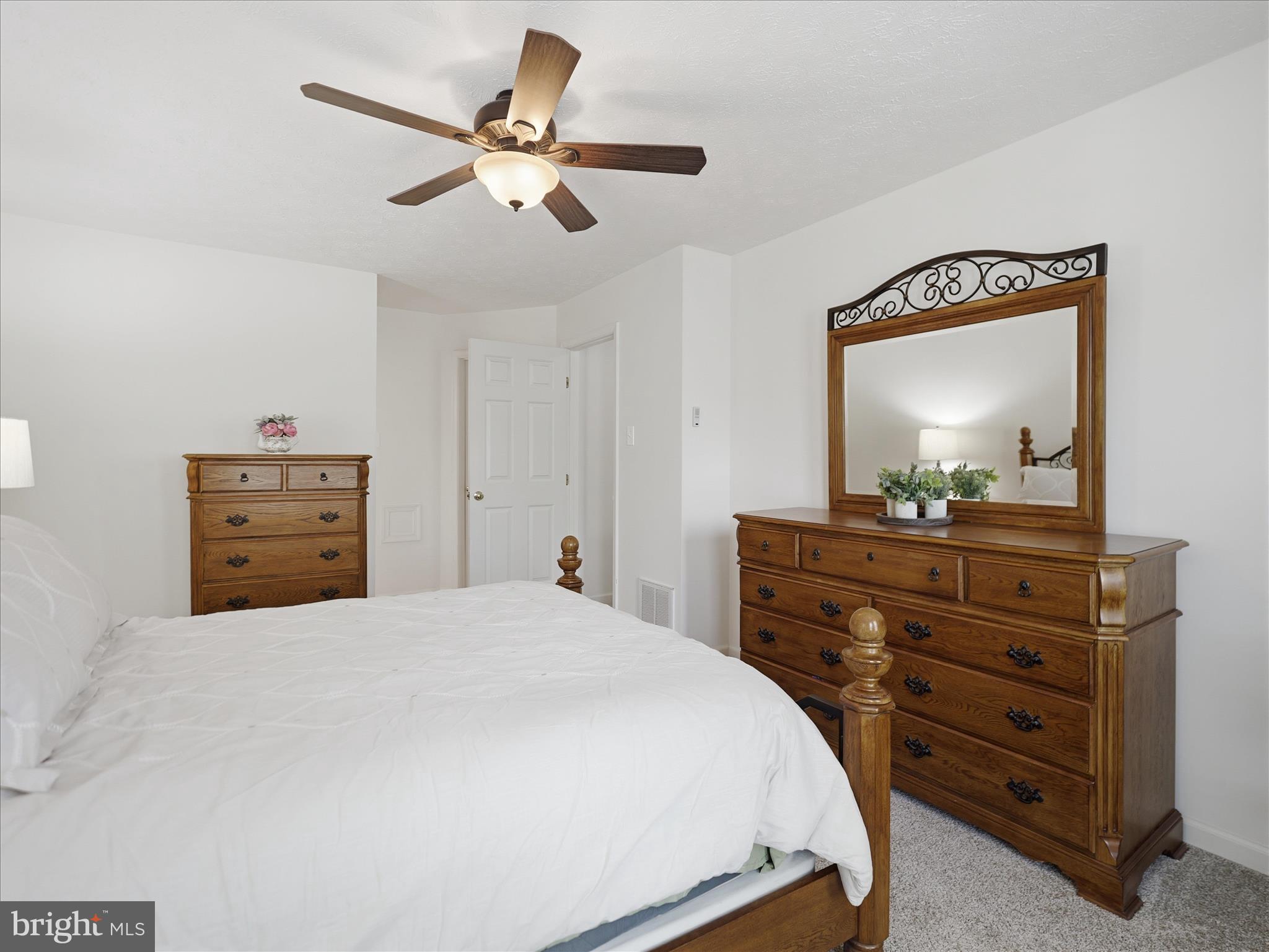 7 Coldstream Court Boonsboro, MD 21713 - Photo 24 of 43 a bedroom with a bed and a dresser