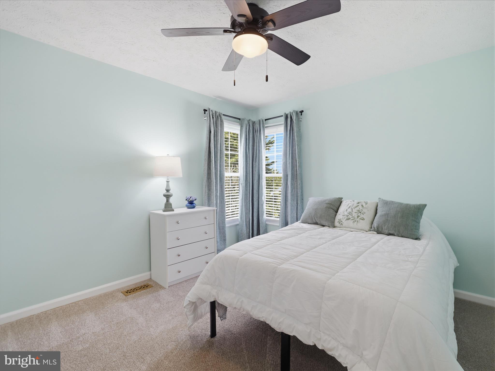 7 Coldstream Court Boonsboro, MD 21713 - Photo 27 of 43 a spacious bedroom with a bed and a chandelier