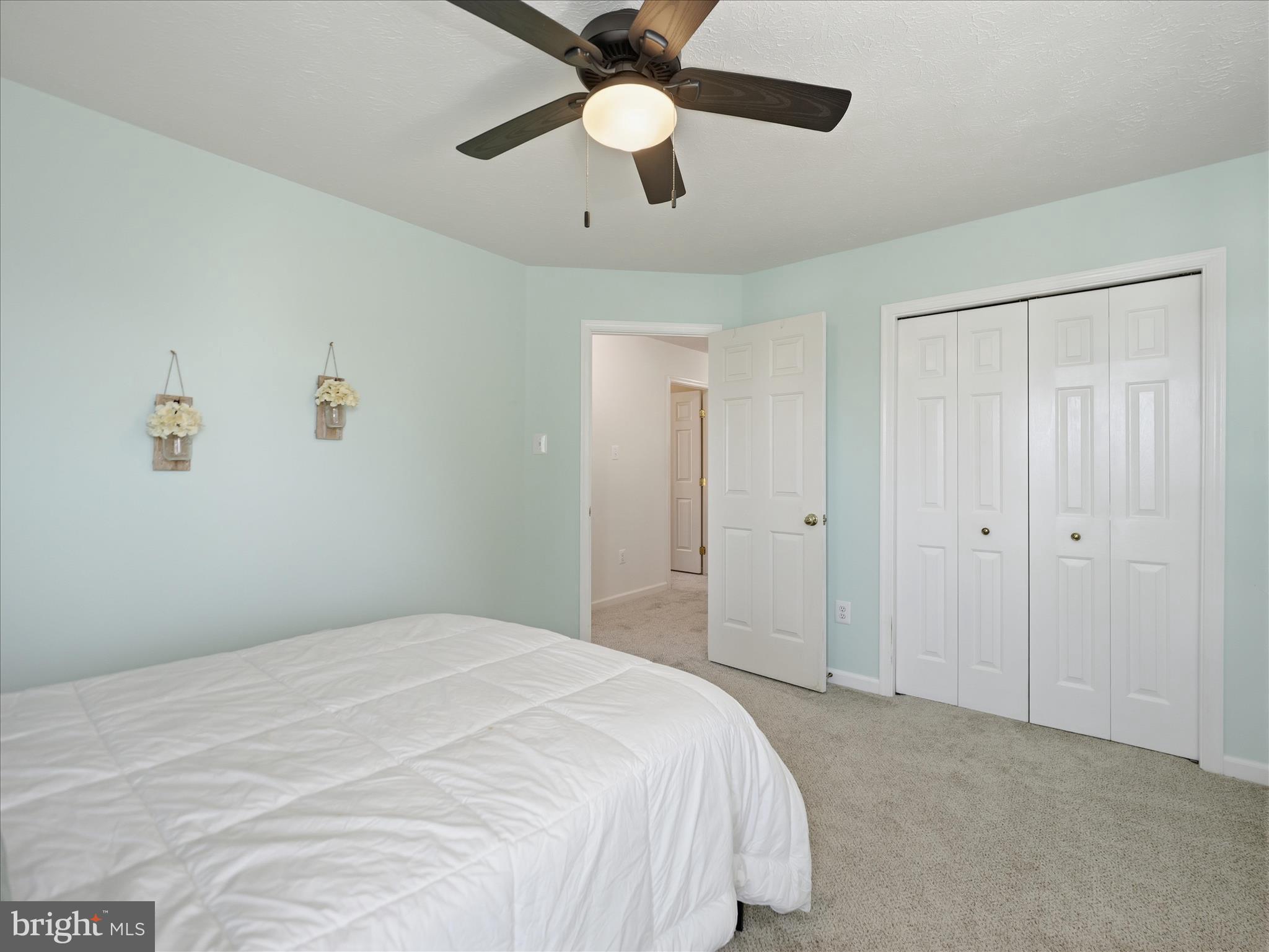 7 Coldstream Court Boonsboro, MD 21713 - Photo 28 of 43 a bedroom with a bed and a chandelier