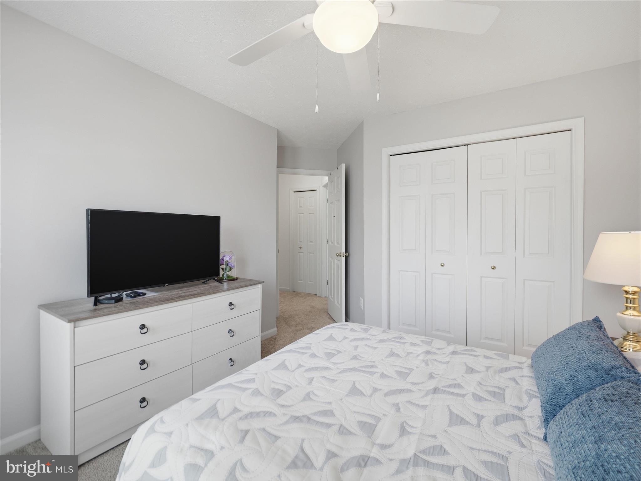 7 Coldstream Court Boonsboro, MD 21713 - Photo 30 of 43 a bedroom with a bed and a flat screen tv in it