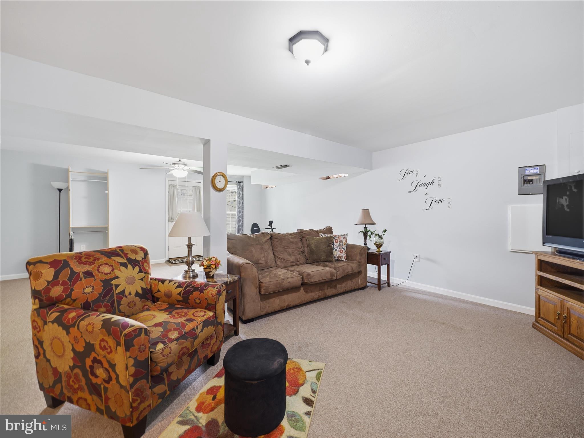 7 Coldstream Court Boonsboro, MD 21713 - Photo 33 of 43 a living room with furniture a couch and a flat screen tv