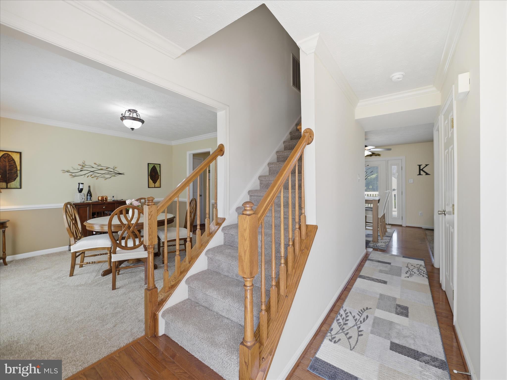 7 Coldstream Court Boonsboro, MD 21713 - Photo 4 of 43 a view of a hallway with wooden floor and furniture