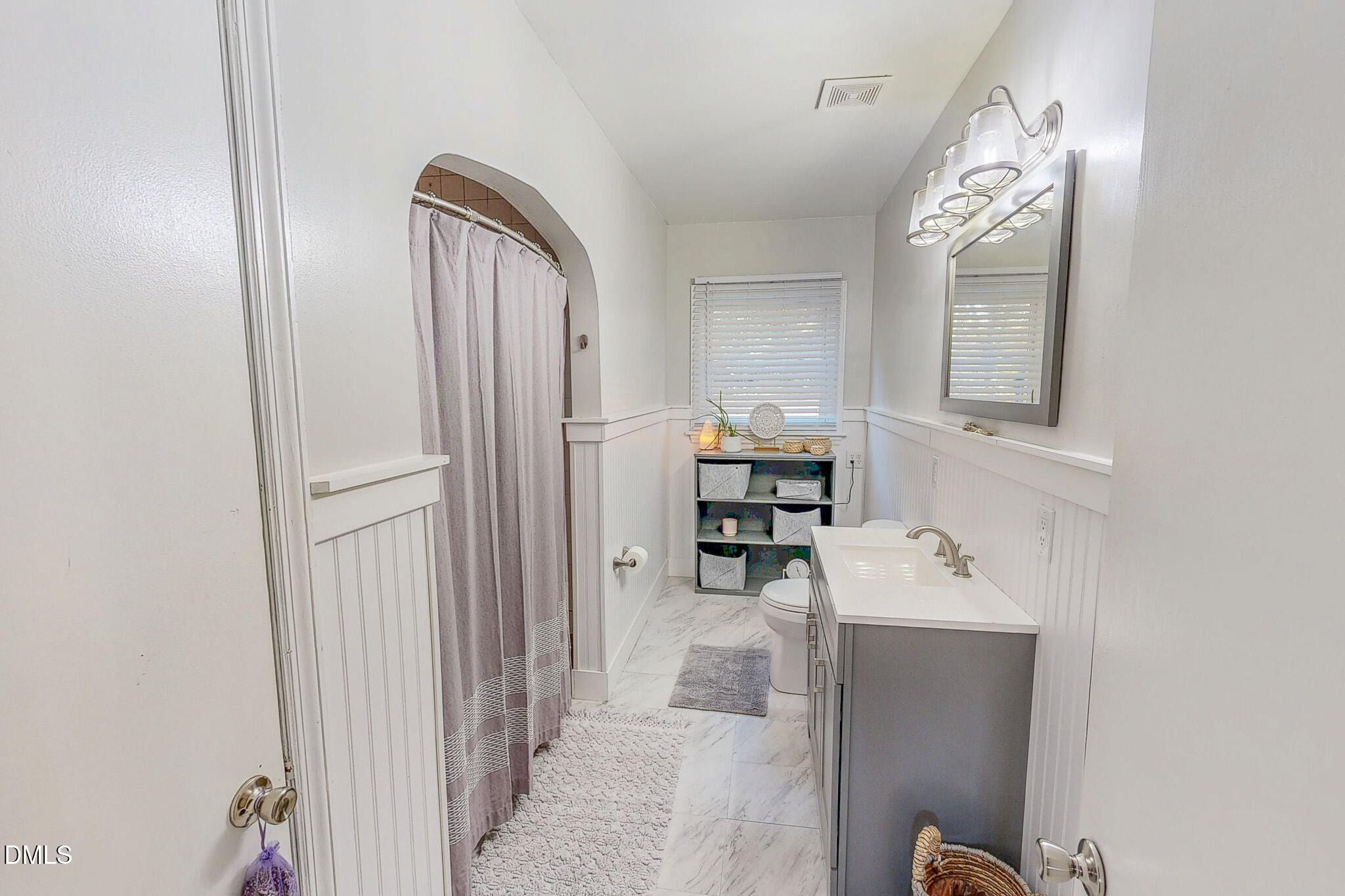 515 Reams Avenue Roxboro, NC 27573 - Photo 16 of 29 a bathroom with a bathtub sink and mirror