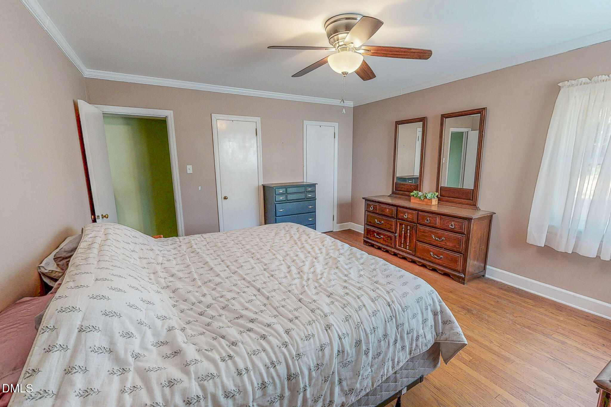 515 Reams Avenue Roxboro, NC 27573 - Photo 18 of 29 a bedroom with a bed and a dresser in it