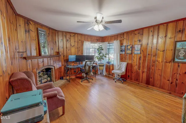 a room with a table and a mirror