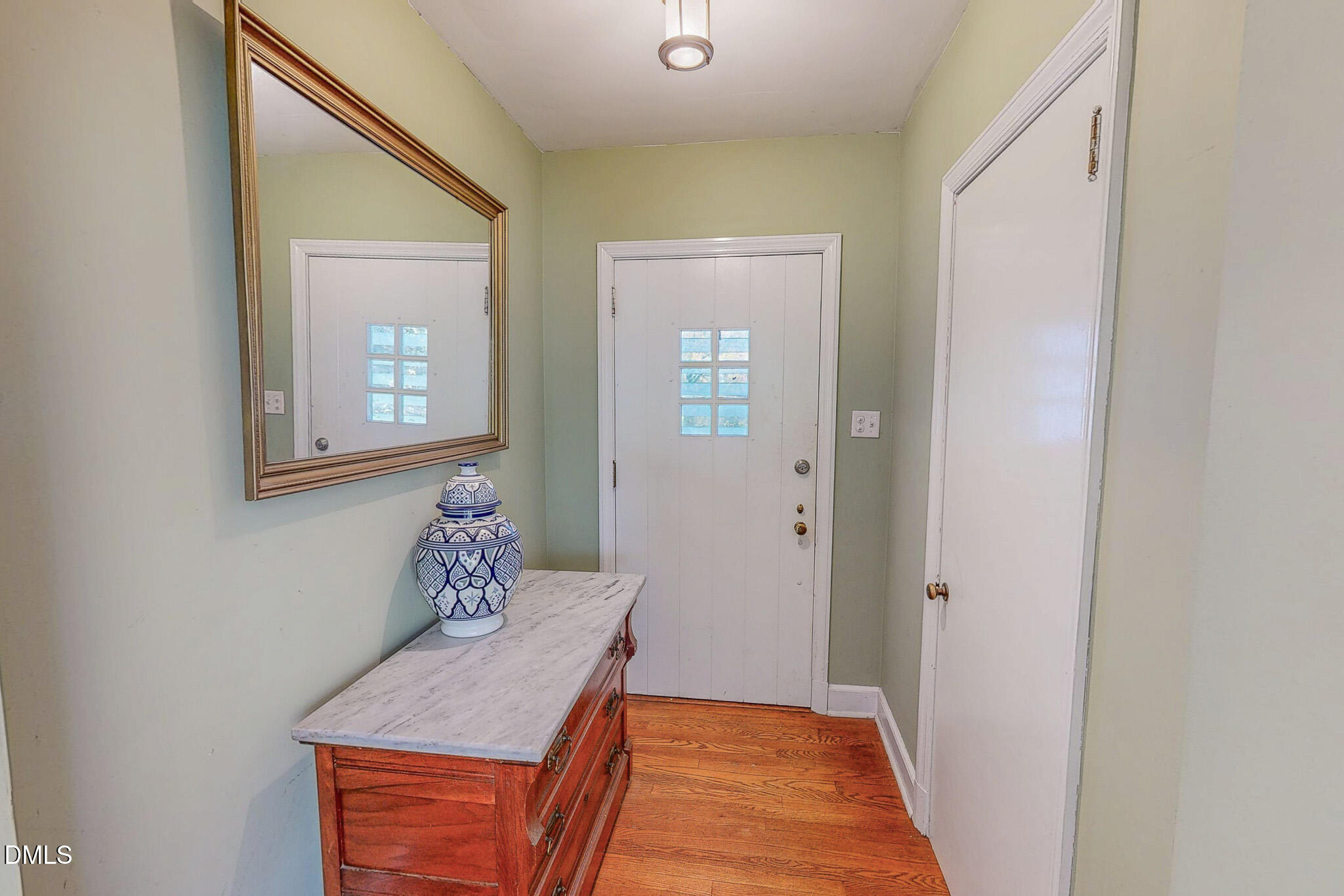 515 Reams Avenue Roxboro, NC 27573 - Photo 21 of 29 a room with a table and a mirror