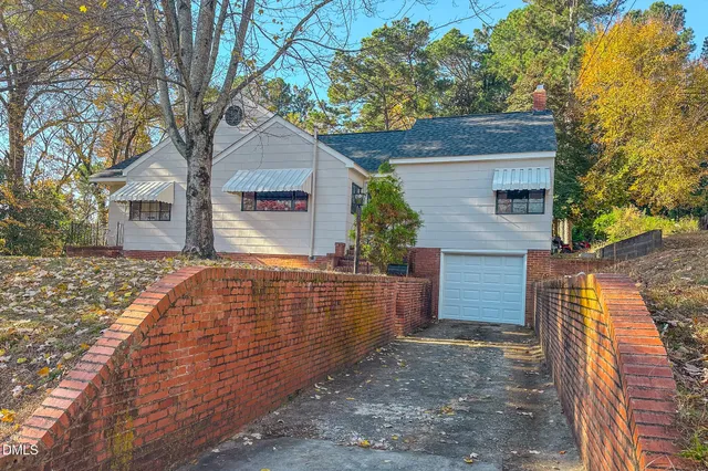 a view of an empty room with a brick wall