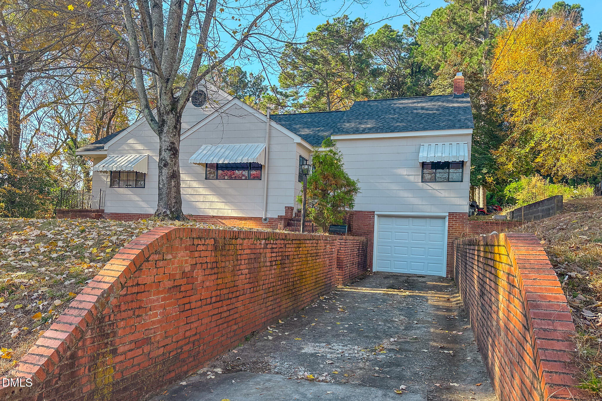 515 Reams Avenue Roxboro, NC 27573 - Photo 24 of 29 a view of house with a tree and wooden fence