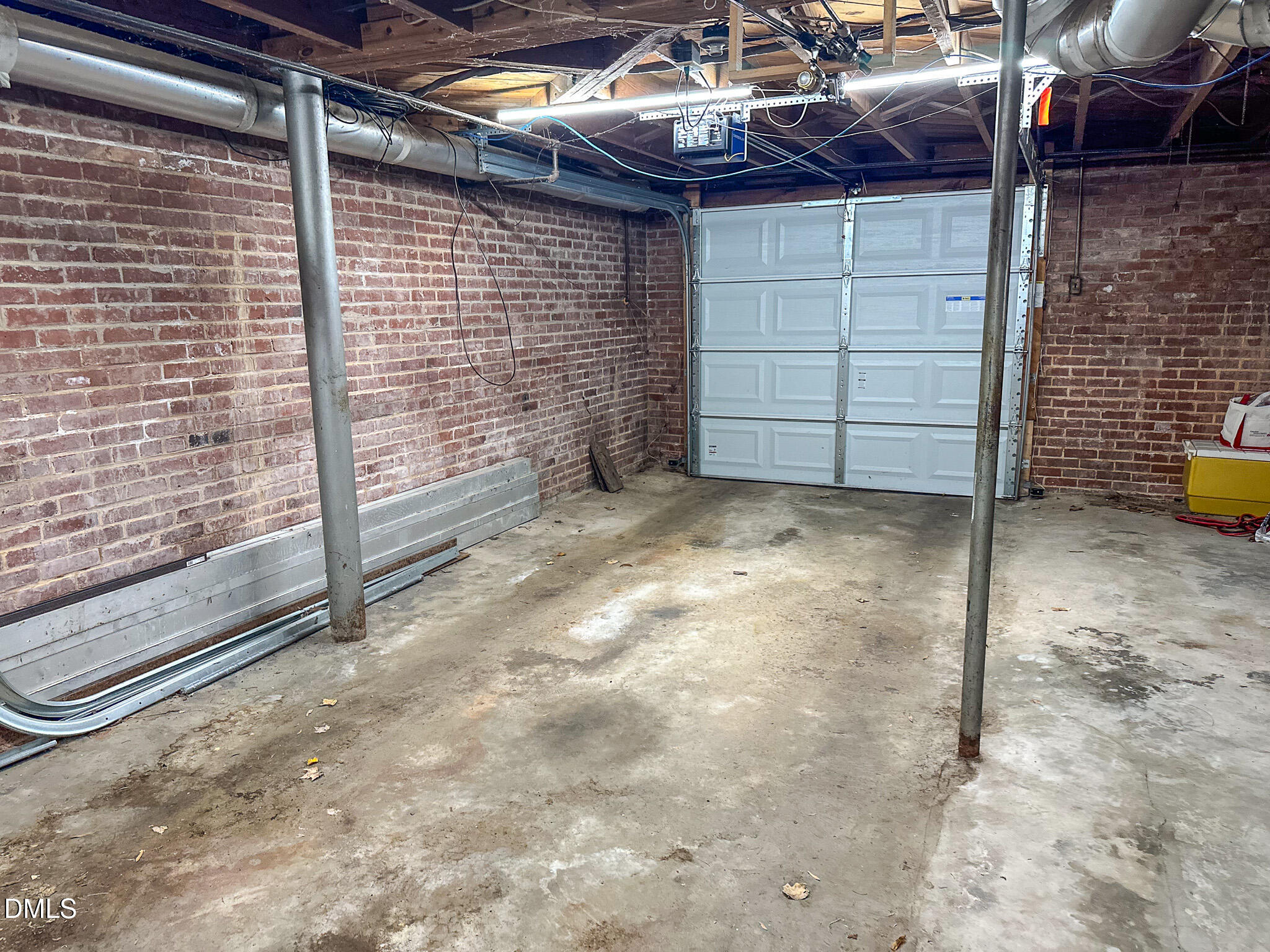 515 Reams Avenue Roxboro, NC 27573 - Photo 25 of 29 a view of an empty room with a brick wall