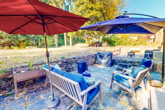 a view of balcony with outdoor seating and wooden floor