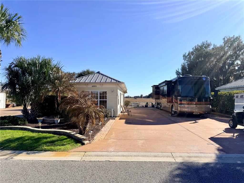 a front view of house with yard outdoor seating and green space